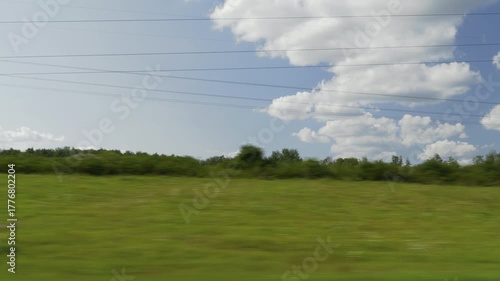 sunny summer day road trip green and wheat harvest field landscape passenger side window pov panorama 4k