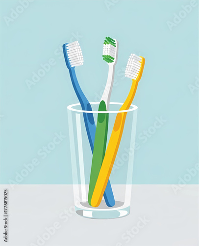 Three brightly colored toothbrushes (blue, green, and yellow) standing upright in a clear glass cup against a simple light blue background.