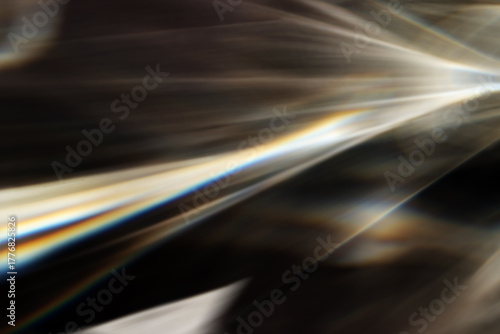 Bild auf Leinwand Blurred Caustic effect light refraction on surface overlay, sun rays refracting through glass prism