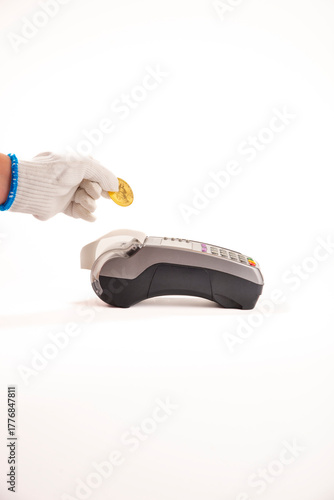Bitcoin, credit card and POS-terminal. The golden bitcoin in male hands. Cryptocurrency bitcoin coins. Litecoin, Bitcoin, Ethereum, e-commerce, busibess, finance concept. crypto currency symbol