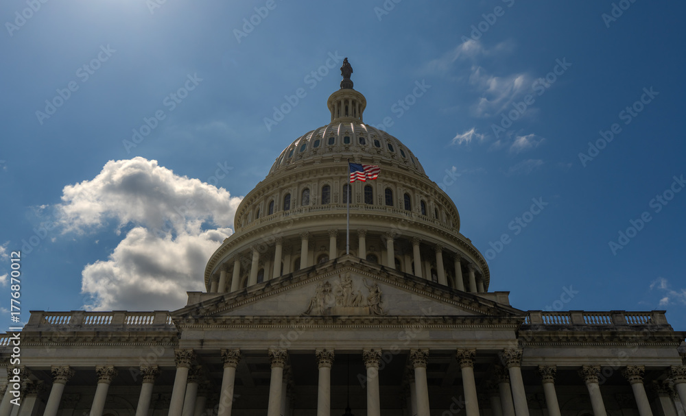 Fototapeta premium Washington DC Capitol building. Congress on Capitol Hill. American flag over Capitol. United States government Capitol landmark. Senate and House in Washington.
