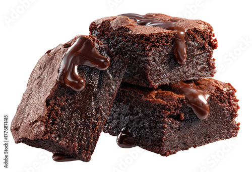 Three rich, decadent brownies stacked, drizzled with melted chocolate