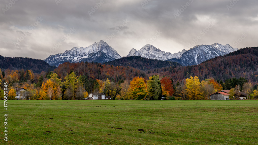 Naklejka premium Scenic view of of Alpine valley with Hohenschwangau castle on mountain background at autumn morning, Schwangau, Germany