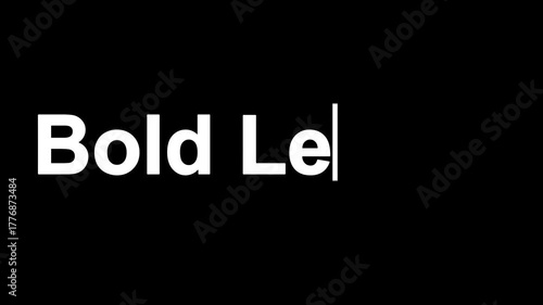 A close up of the words bold letter in white on a black background with a blinking cursor