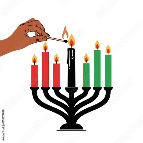 Hand lighting unity candle in celebration of Kwanzaa  