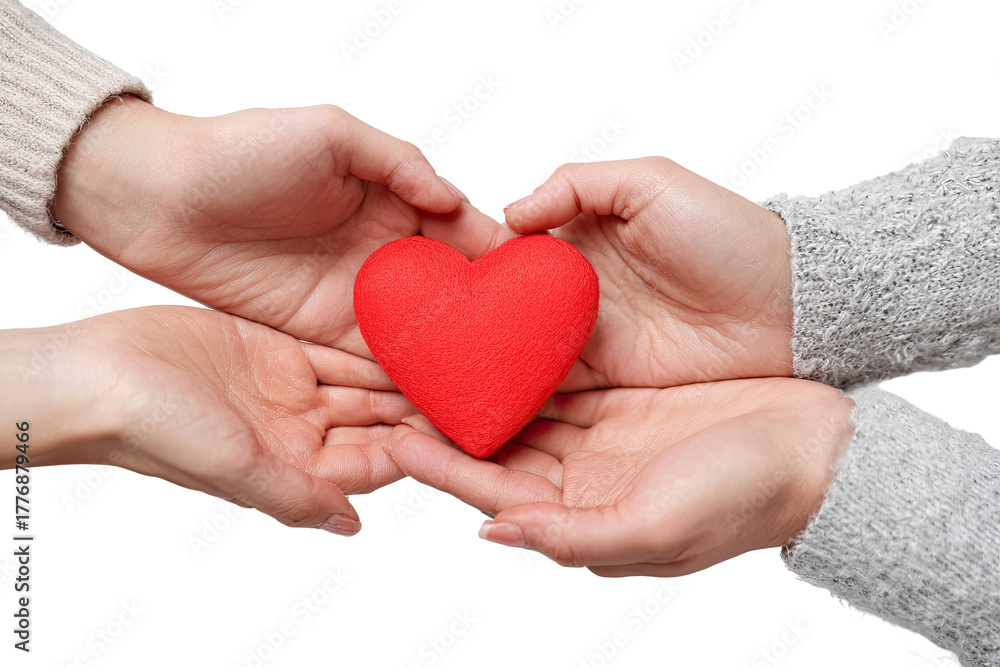 Fototapeta premium Two hands gently holding a red heart