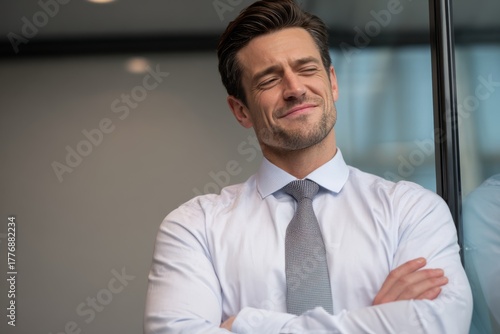 Wallpaper Mural Confident businessman smirking slightly with arms crossed, showing pride and self-assurance. Torontodigital.ca