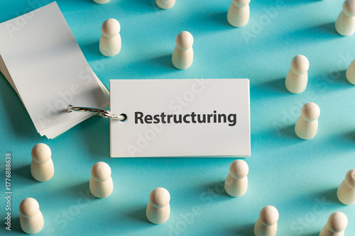 There is word card with the word Restructuring. It is as an eye-catching image.