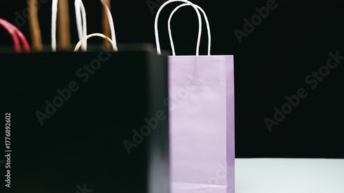 Black Friday gift bags in a store frantically swapped with a black background