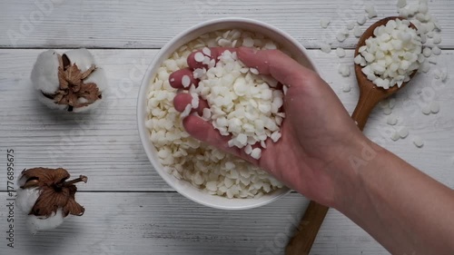 Granules of the soy wax in a bowl. Preparation for making candles. Candle making hobby.