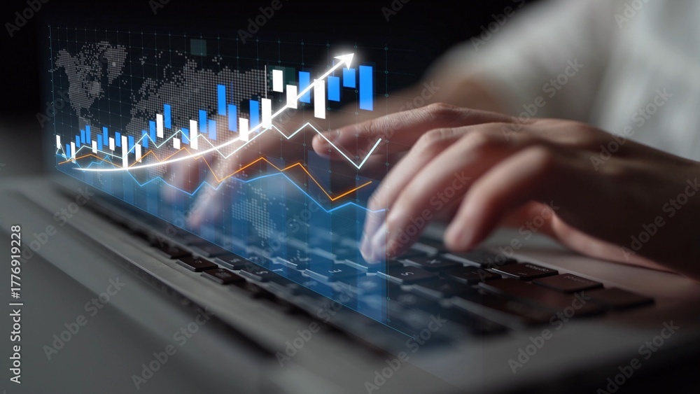 Fototapeta premium Focused hands typing on a laptop with an overlay of a financial chart, representing the intersection of technology and economic analysis in a modern workspace. Copula