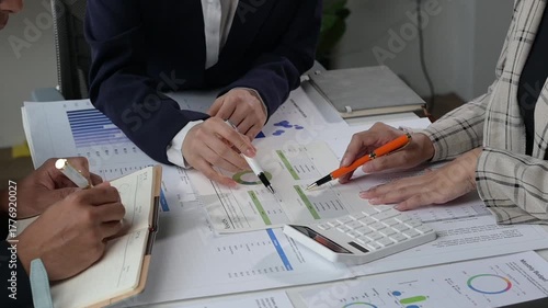 Business team analyzing financial data and charts