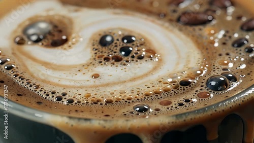 intensely magnified view of the frothy surface and textural details of a brewed