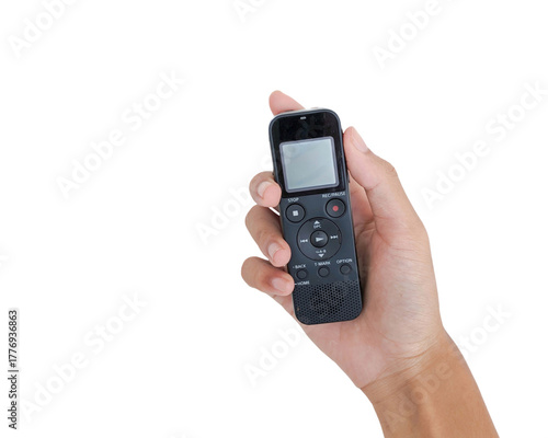 An Asian hand holding a black voice recorder device isolated on a white background, suitable for illustrating technology, audio recording, journalism, or digital sound equipment.