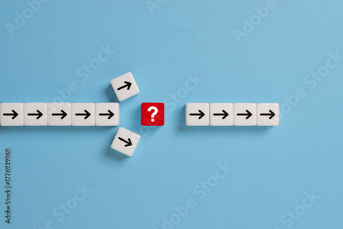 Question mark print screen on red dice cross in the middle of arrow for interrupt of process concept.