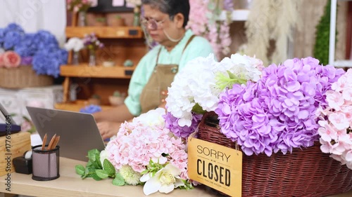Senior woman entrepreneur struggling to understand computer technology, overwhelmed by modern systems in computer, elderly aging people learning digital online, florist shop owner lacks digital skills