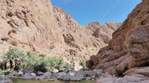 Wadi Ash Shab is a dramatic canyon in Oman famous for its hiking trail leading to emerald pools, a hidden cave, and a stunning internal waterfall.
