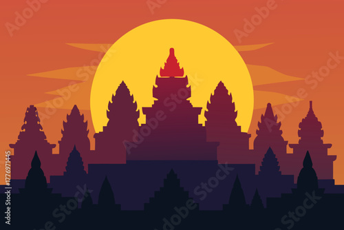 Silhouette of Angkor Wat against a vibrant sunset. The temple's spires are dark and detailed, set against an orange and yellow sky with a large sun.
