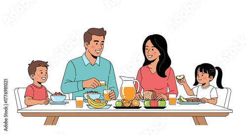 Family of four eats breakfast at a table laden with cereal fruit toast and orange juice