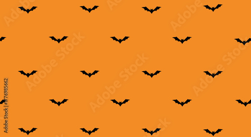 Orange background with a repeating pattern of small, black bat silhouettes, perfect for Halloween.