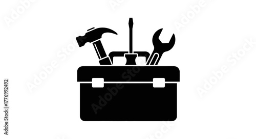 Black silhouette of tools inside an open toolbox illustration