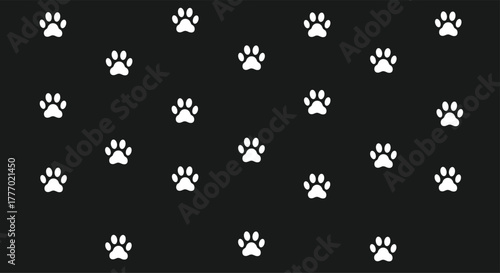 A seamless pattern of bright white animal paw prints is scattered across a dark black background, creating a simple and graphic design.