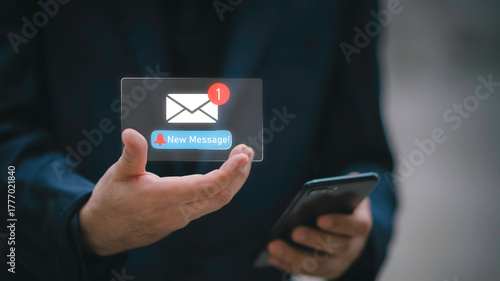 Businessman touching new message notification icon on virtual screen,email alert, online messaging system, representing digital communication, instant response, and business connectivity.