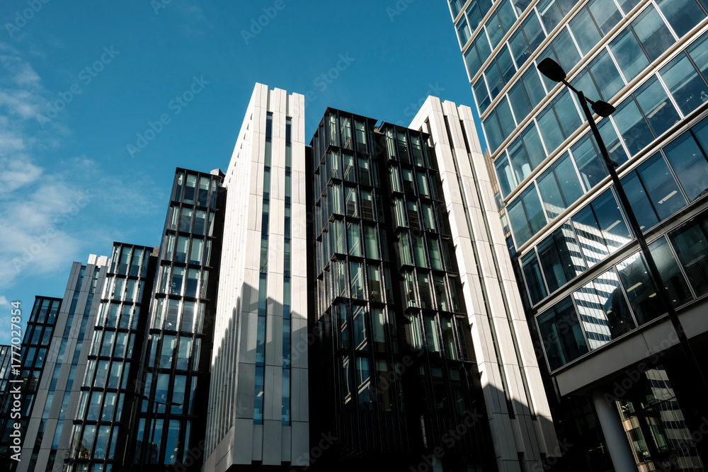 Naklejka premium Modern downtown buildings against clear blue sky