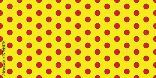 Bright yellow background with red polka dots a fun and playful pattern ideal for backgrounds textiles and graphic design projects. EPS vector illustration