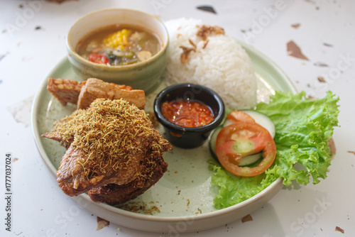 Traditional Indonesian Fried Chicken with Rice and Soup