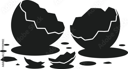 Black broken eggshell halves and fragments on white background