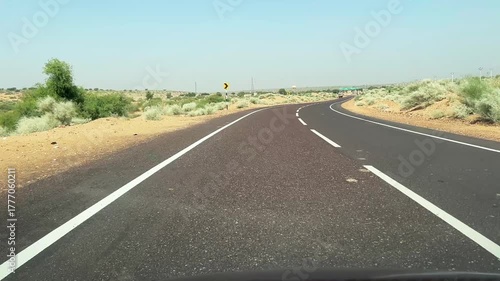 Road through the desert between Jaisalmer and Tanot, near Jaisalmer India.