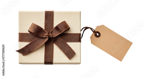 A beige square gift box with a brown ribbon and bow, plus a blank gift tag