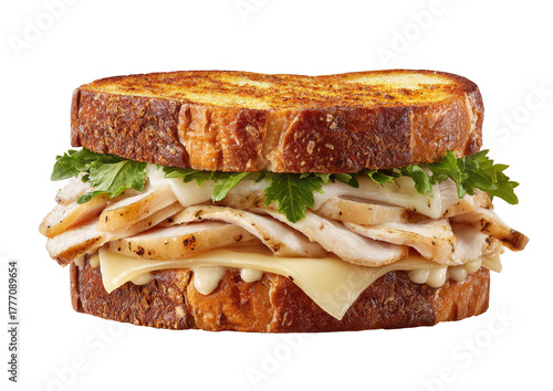 Grilled sandwich featuring turkey, cheese, and greens between toasted bread slices
