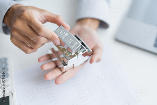 Silver bar Trading business man hand offering silver Investment financial report Trading Pure silver precious metals investment  on the stock exchange Rising prices.