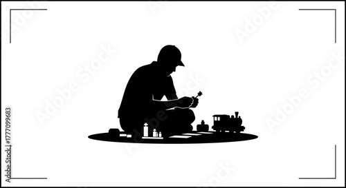 Engrossed in Craftsmanship A Silhouette of a Man Lovingly Assembling a Classic Toy Train Set Evoking Nostalgia and Delight Perfect for Family Time Projects and Hobby Enthusiasts