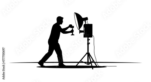 Dynamic photographer capturing a moment with professional studio lighting equipment, creating impactful visuals for commercial projects and artistic endeavors.