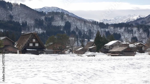natural landscape view to gassho zukuri house style in Shirakawago village with white snow covered all area in the village in winter snow sunny time.famous landscape countryside winter snow village