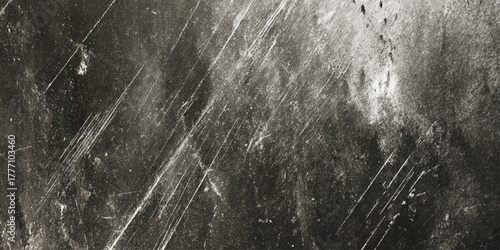 Dark and heavily distressed textured concrete surface ideal for modern industrial design.