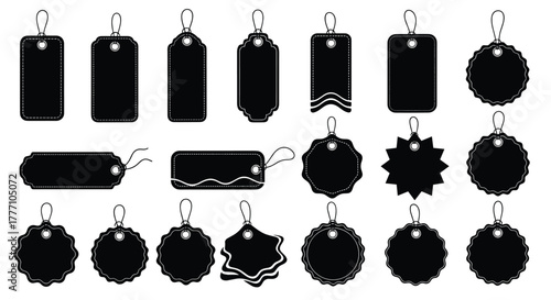 Diverse collection of black blank price tags and labels featuring various decorative shapes and edges with string loops, isolated on white.