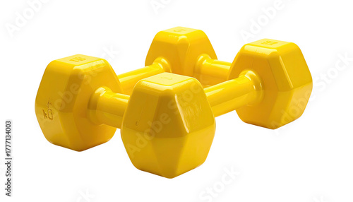 Pair of bright yellow dumbbells sit on dark backdrop