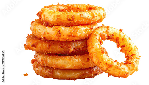 Stacked golden, crispy onion rings on black background