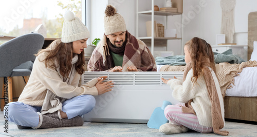 Frozen family warming near ...