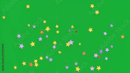 Wallpaper Mural Abstract background of multicolored star-shaped confetti floating on a green screen, ideal for festive events and video editing Torontodigital.ca