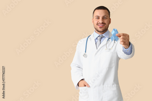 Male urologist with blue ri...