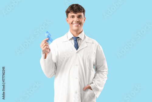 Male doctor with blue ribbo...