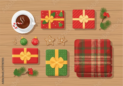 Overhead view of Christmas gifts, hot chocolate, and festive decorations on wooden surface.