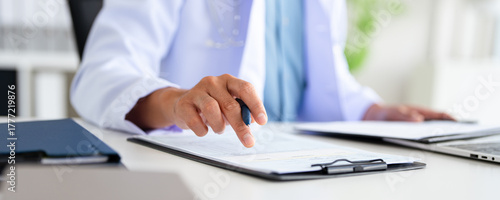  closeup Hand Writing, book and notebook by doctor or healthcare professional with a prescription or making notes in an office.