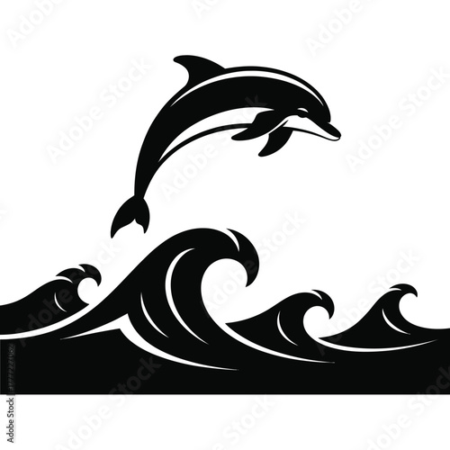 Silhouette of a dolphin leaping over ocean waves