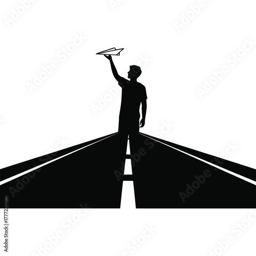 Silhouette of a person launching a paper airplane from a high vantage point